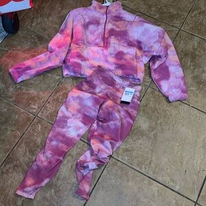 Pink multiple colored Nike pullover sweater with stretch leggings to match